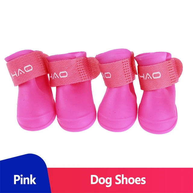 waterproof dog boots (Anti-Slip Rain Shoes) for pets in pink with adjustable straps and anti-slip soles.