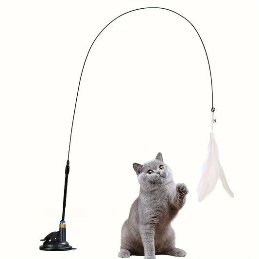 Cat Teaser Toy with feather and base, attracting a playful grey cat.